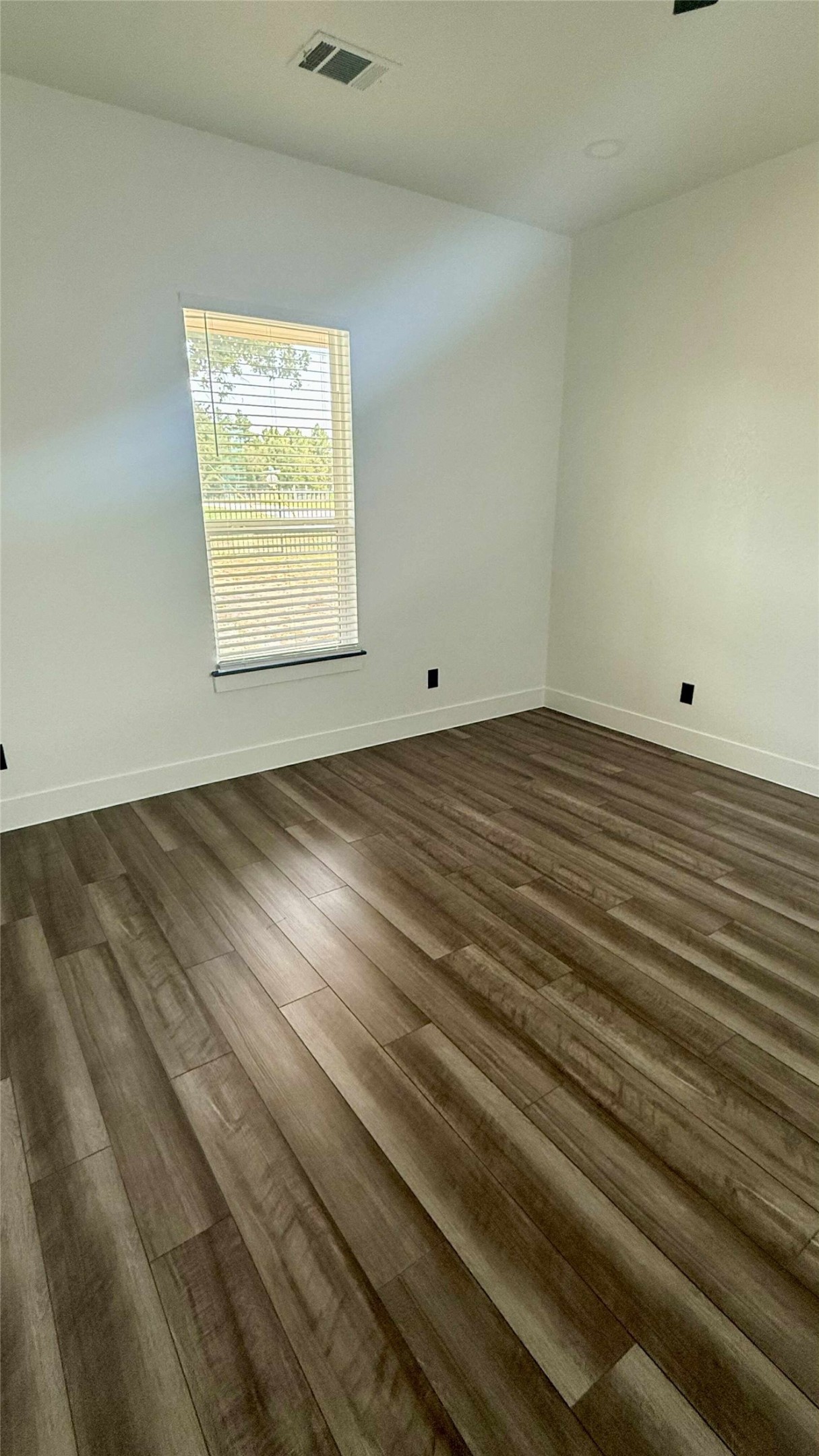 146 Buena Fortuna Road Elgin, TX 78621 - Photo 11 of 15 a view of an empty room and window
