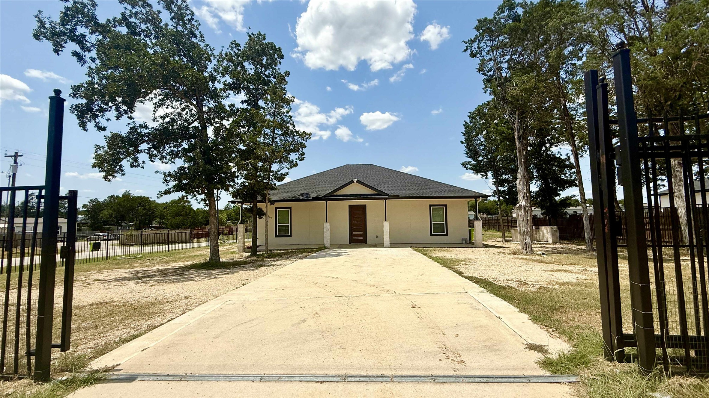 146 Buena Fortuna Road Elgin, TX 78621 - Photo 2 of 15 a view of a house with a yard