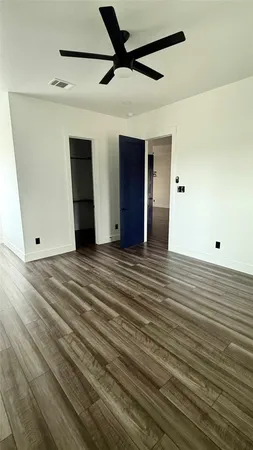 a view of a livingroom with wooden floor