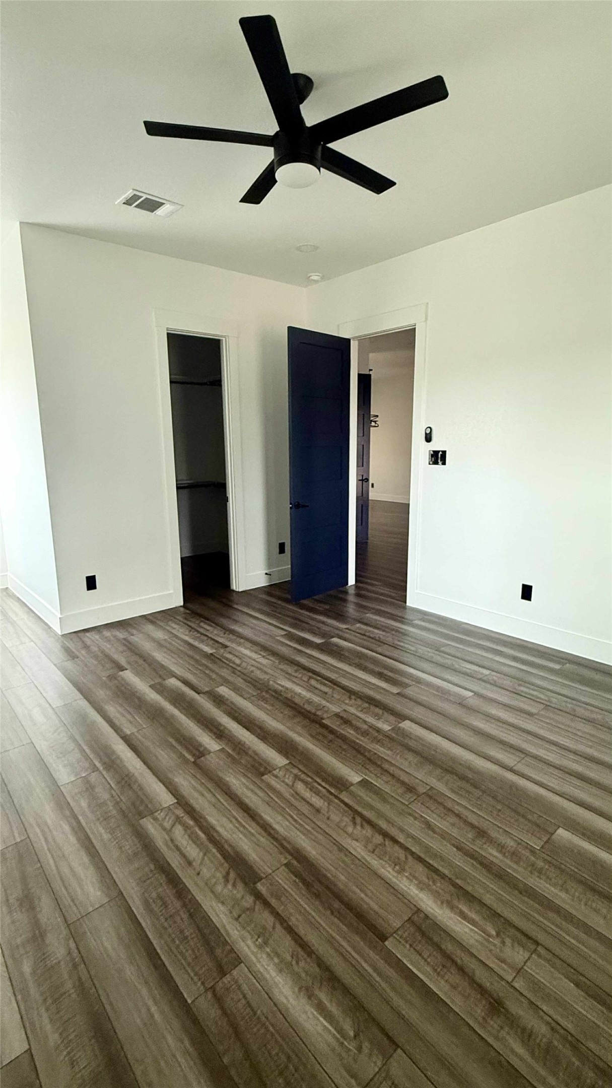 146 Buena Fortuna Road Elgin, TX 78621 - Photo 5 of 15 a view of a livingroom with wooden floor