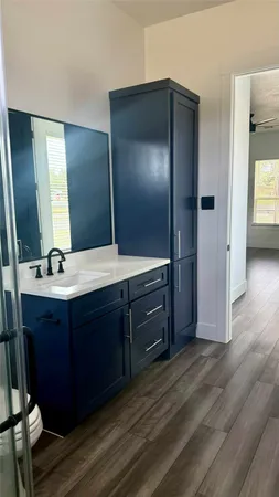 a bathroom with a sink and a mirror