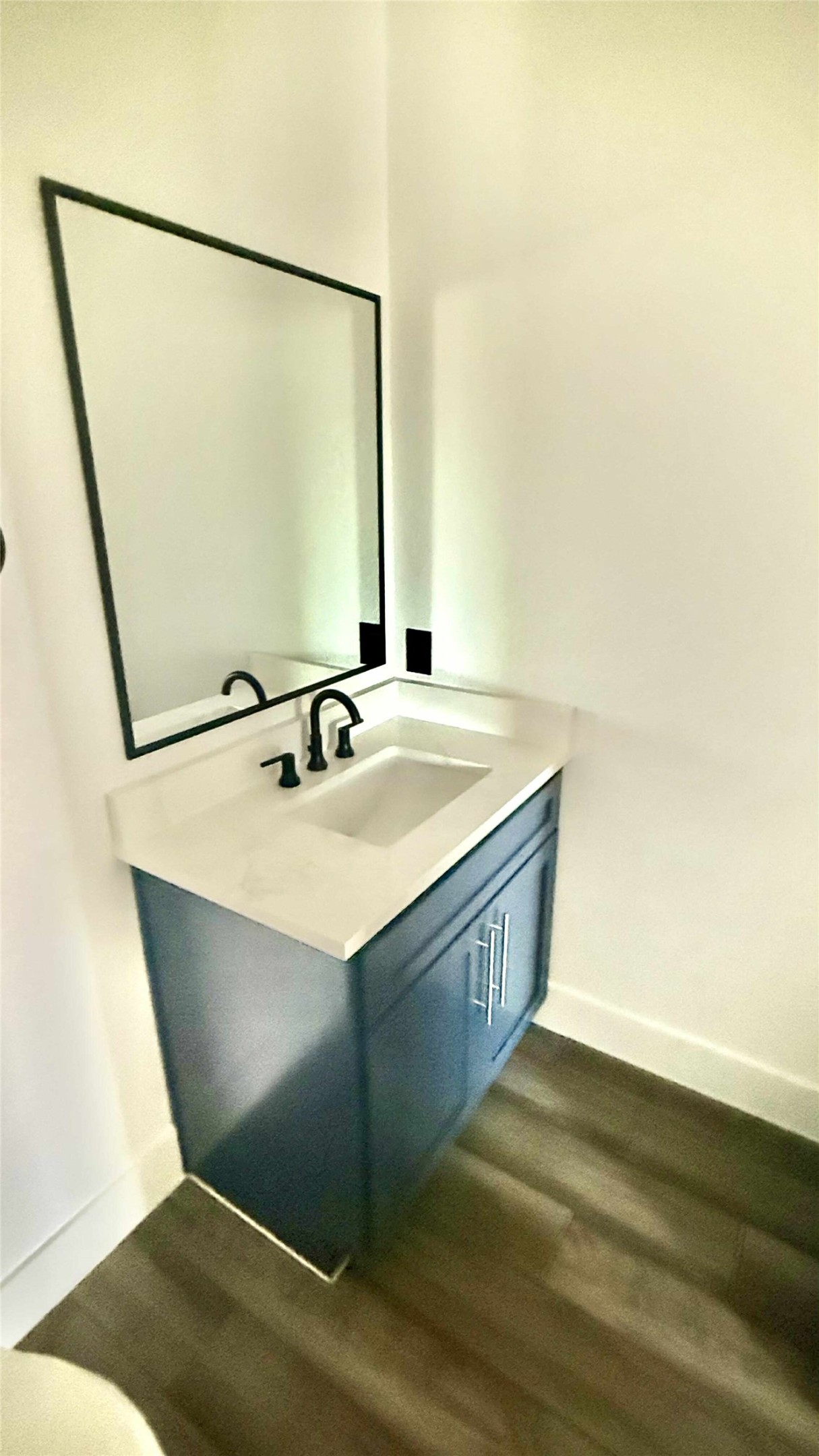 146 Buena Fortuna Road Elgin, TX 78621 - Photo 10 of 15 a bathroom with a sink and a mirror