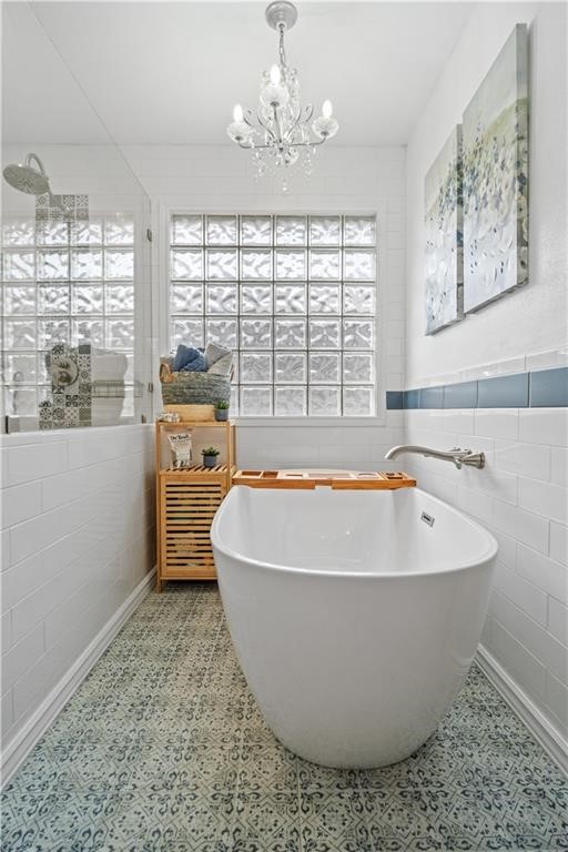 311 Blue Water Drive Portland, TX 78374 - Photo 12 of 25 a white bath tub sitting in a room next to a window