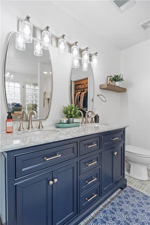 311 Blue Water Drive Portland, TX 78374 - Photo 14 of 25 a bathroom with a granite countertop sink and a mirror