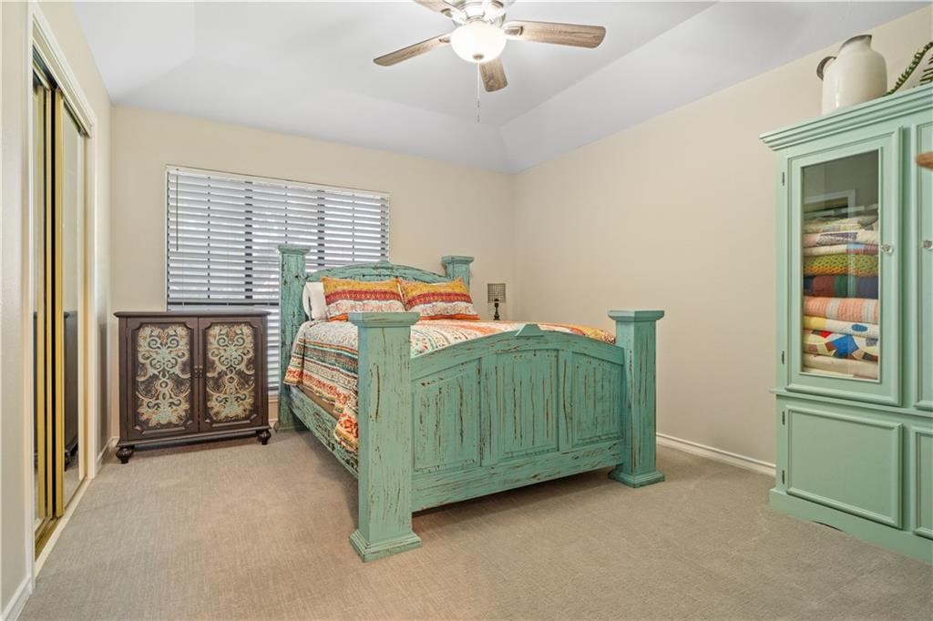 311 Blue Water Drive Portland, TX 78374 - Photo 16 of 25 a bedroom with a bed and a baby crib