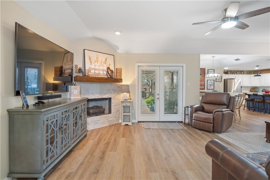 311 Blue Water Drive Portland, TX 78374 - Photo 2 of 25 a living room with furniture and a fireplace