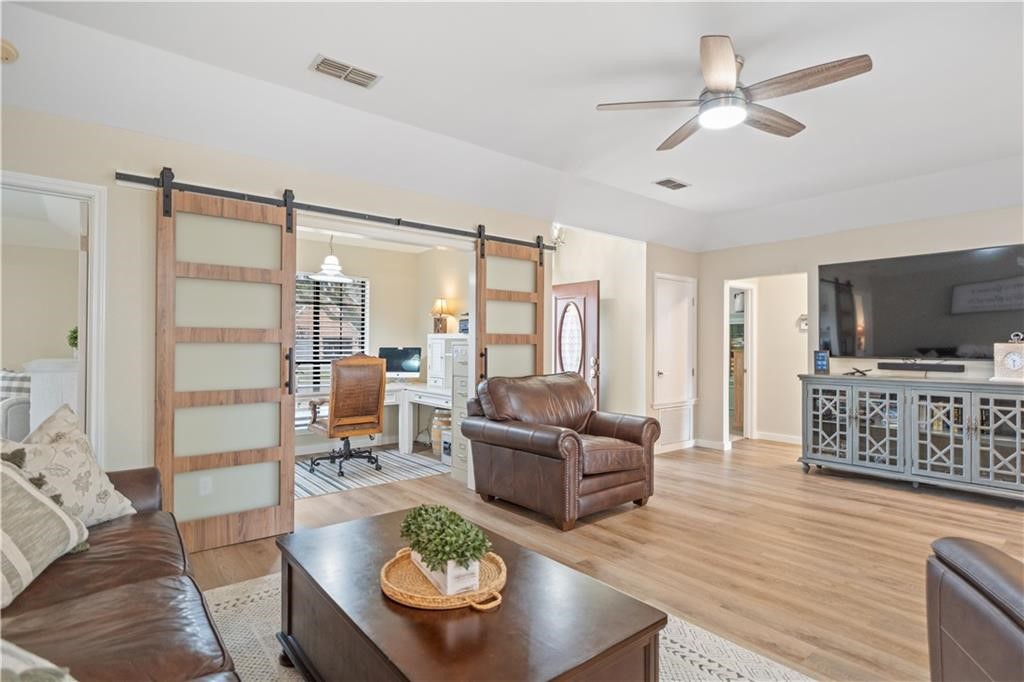 311 Blue Water Drive Portland, TX 78374 - Photo 4 of 25 a living room with furniture and a flat screen tv