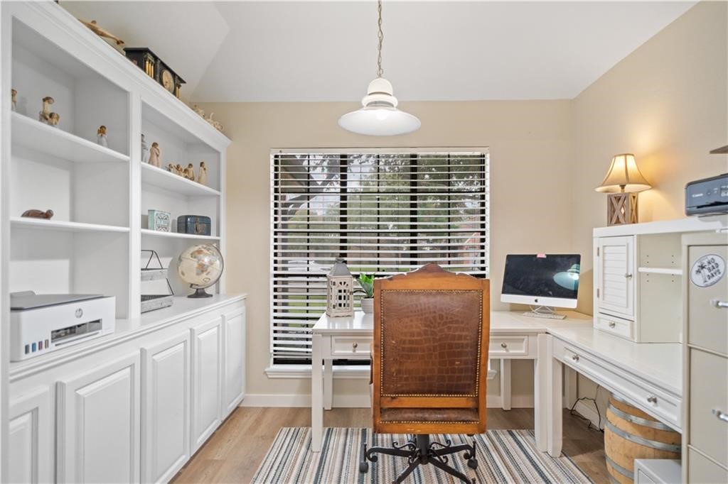 311 Blue Water Drive Portland, TX 78374 - Photo 6 of 25 a kitchen with stainless steel appliances windows and wooden floor