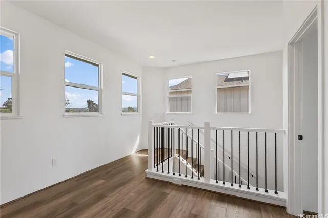 a view of wooden floor with windows