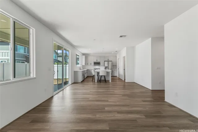a view of a livingroom with furniture and wooden floor