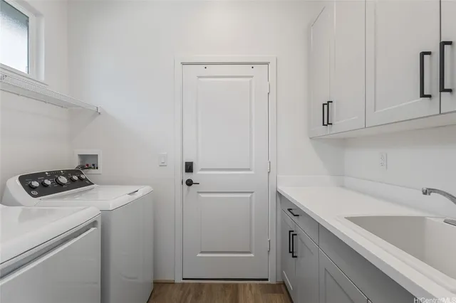 a view of a storage and utility room with a sink