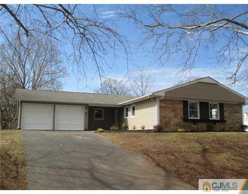 12 Indiana Road Somerset, NJ 08873 - Photo 1 of 12 a front view of a house with a yard