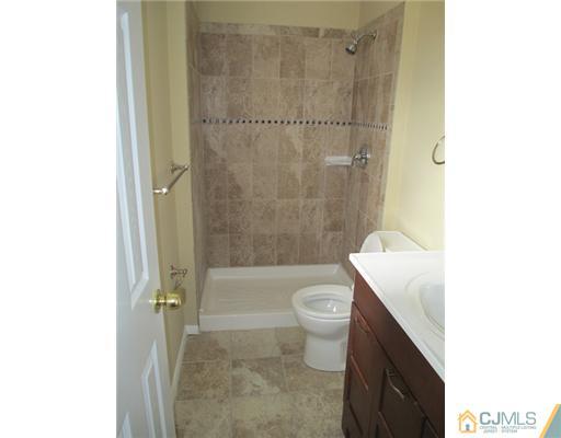 12 Indiana Road Somerset, NJ 08873 - Photo 6 of 12 a bathroom with a shower and a toilet