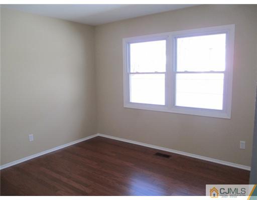 12 Indiana Road Somerset, NJ 08873 - Photo 9 of 12 an empty room with a window