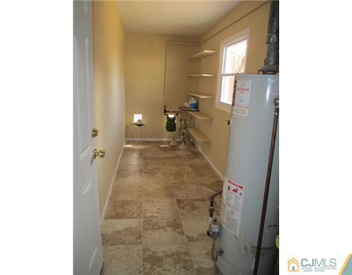 12 Indiana Road Somerset, NJ 08873 - Photo 10 of 12 a bathroom with a sink and a mirror