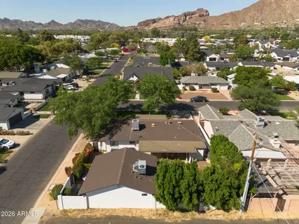 an aerial view of residential houses with outdoor space
