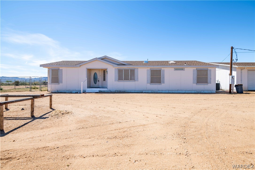 4229 Cove Road Golden Valley, AZ 86413 - Photo 1 of 36 a front view of a house with a yard