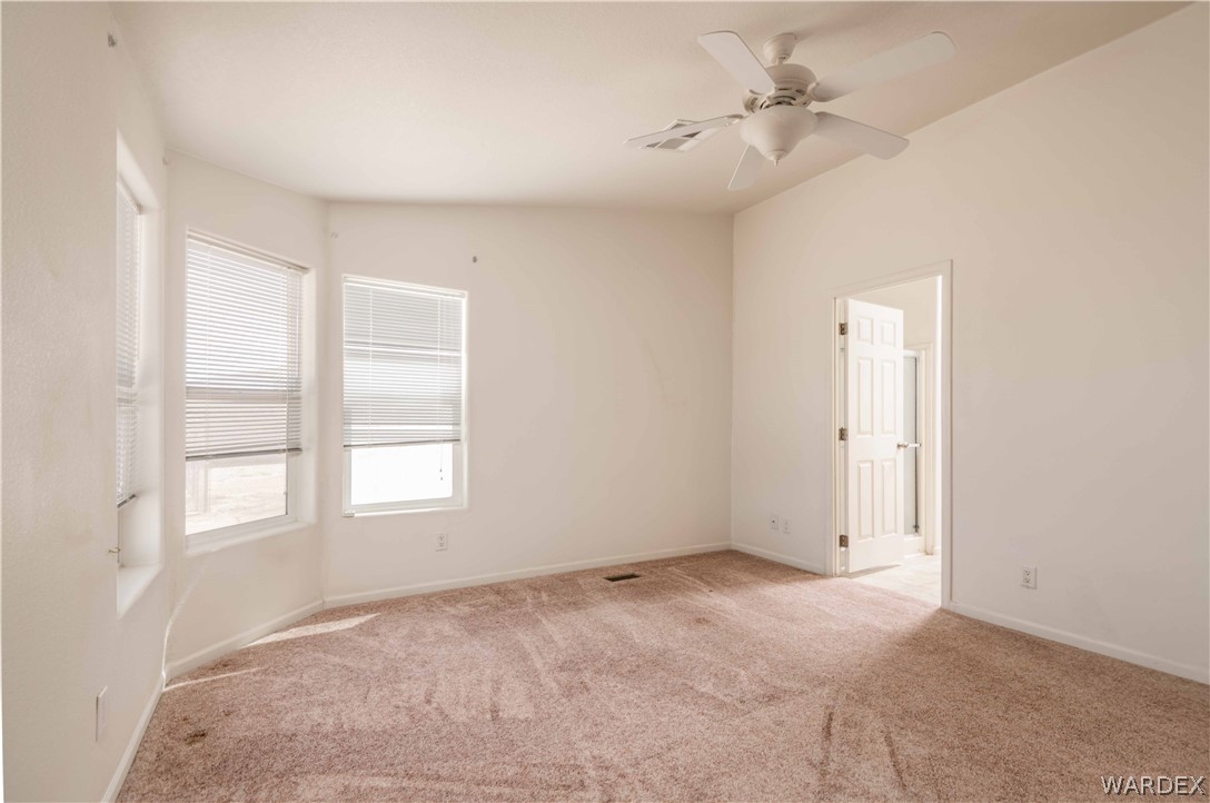 4229 Cove Road Golden Valley, AZ 86413 - Photo 13 of 36 a view of an empty room with a window