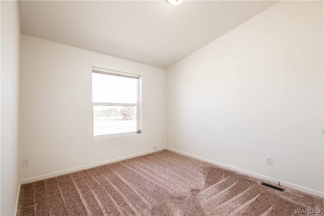 4229 Cove Road Golden Valley, AZ 86413 - Photo 24 of 36 an empty room with a window