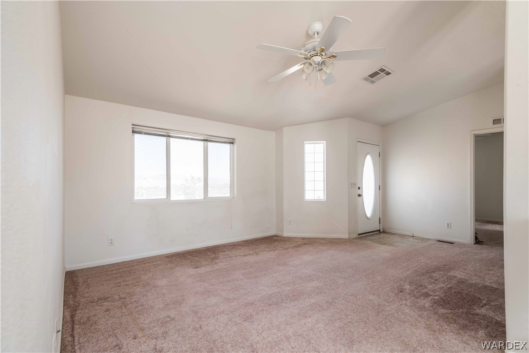 4229 Cove Road Golden Valley, AZ 86413 - Photo 4 of 36 a view of an empty room with a window