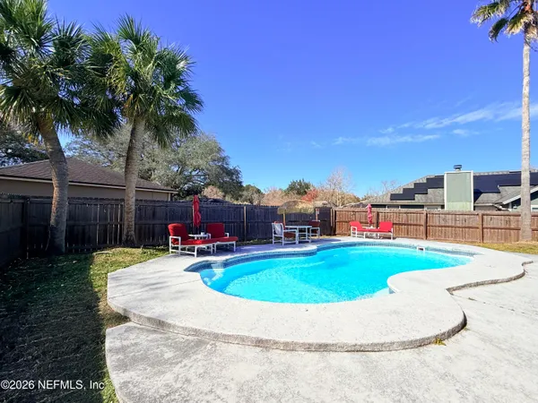 a front view of house with yard and seating area