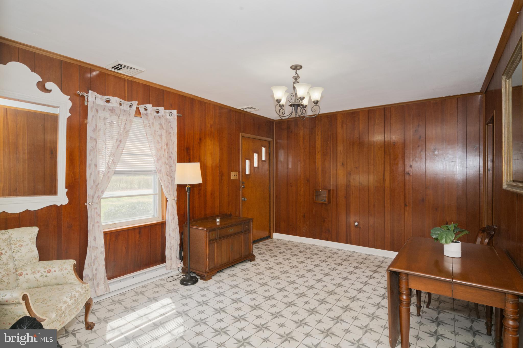89 Cooper Road Dover, DE 19901 - Photo 13 of 32 a bedroom with a bed and a chandelier