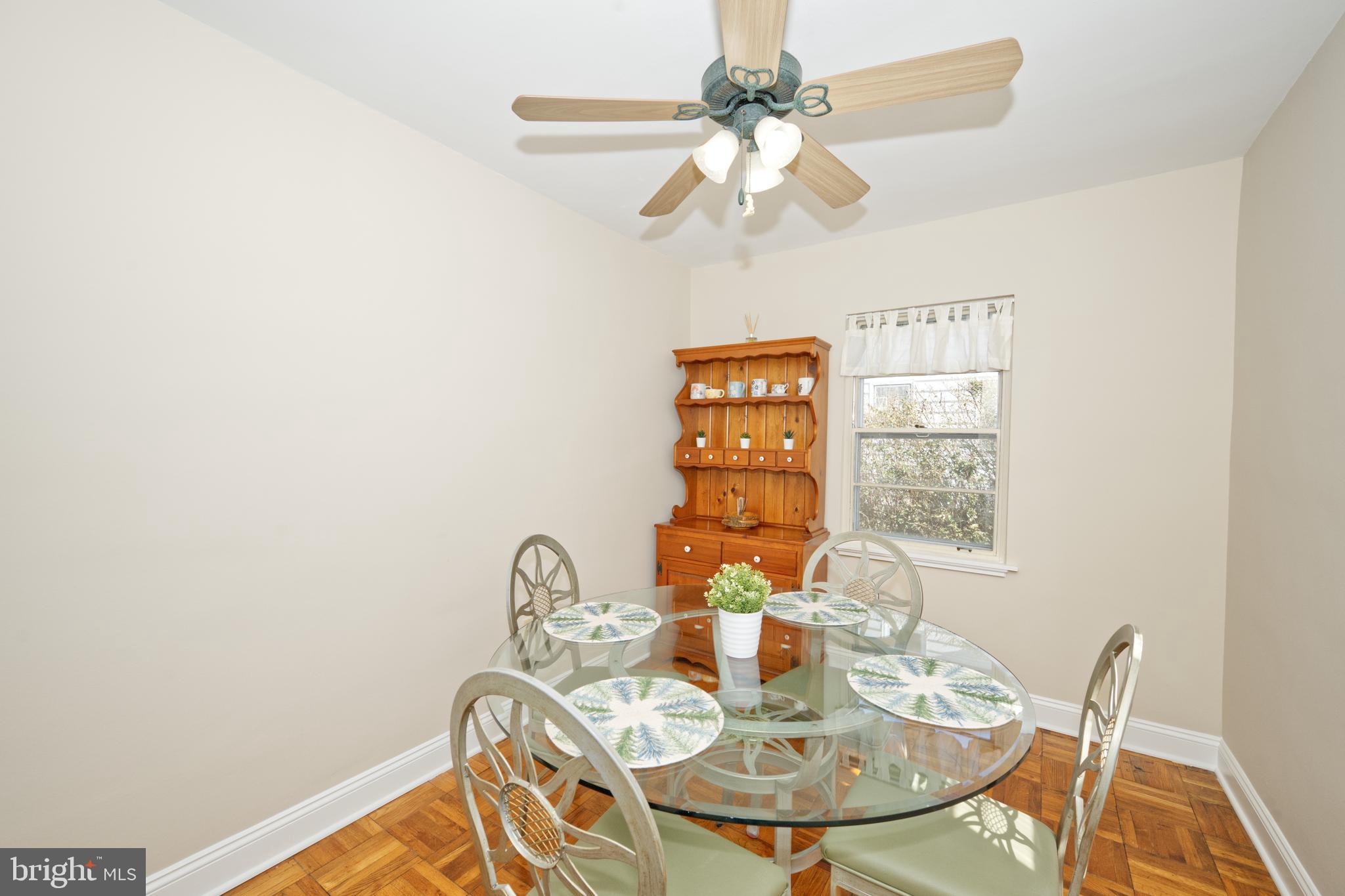 89 Cooper Road Dover, DE 19901 - Photo 15 of 32 a view of a dining room with furniture and a chandelier