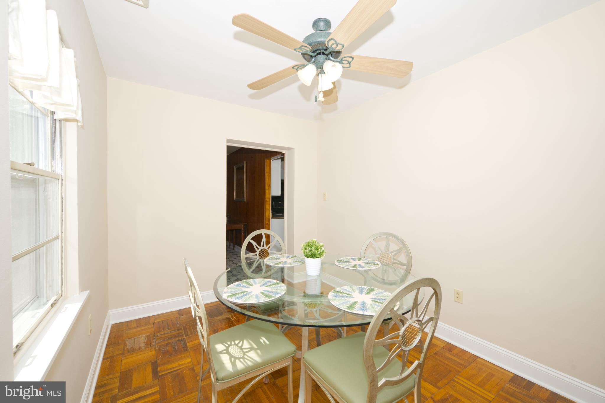 89 Cooper Road Dover, DE 19901 - Photo 16 of 32 a view of a dining room with furniture and a chandelier