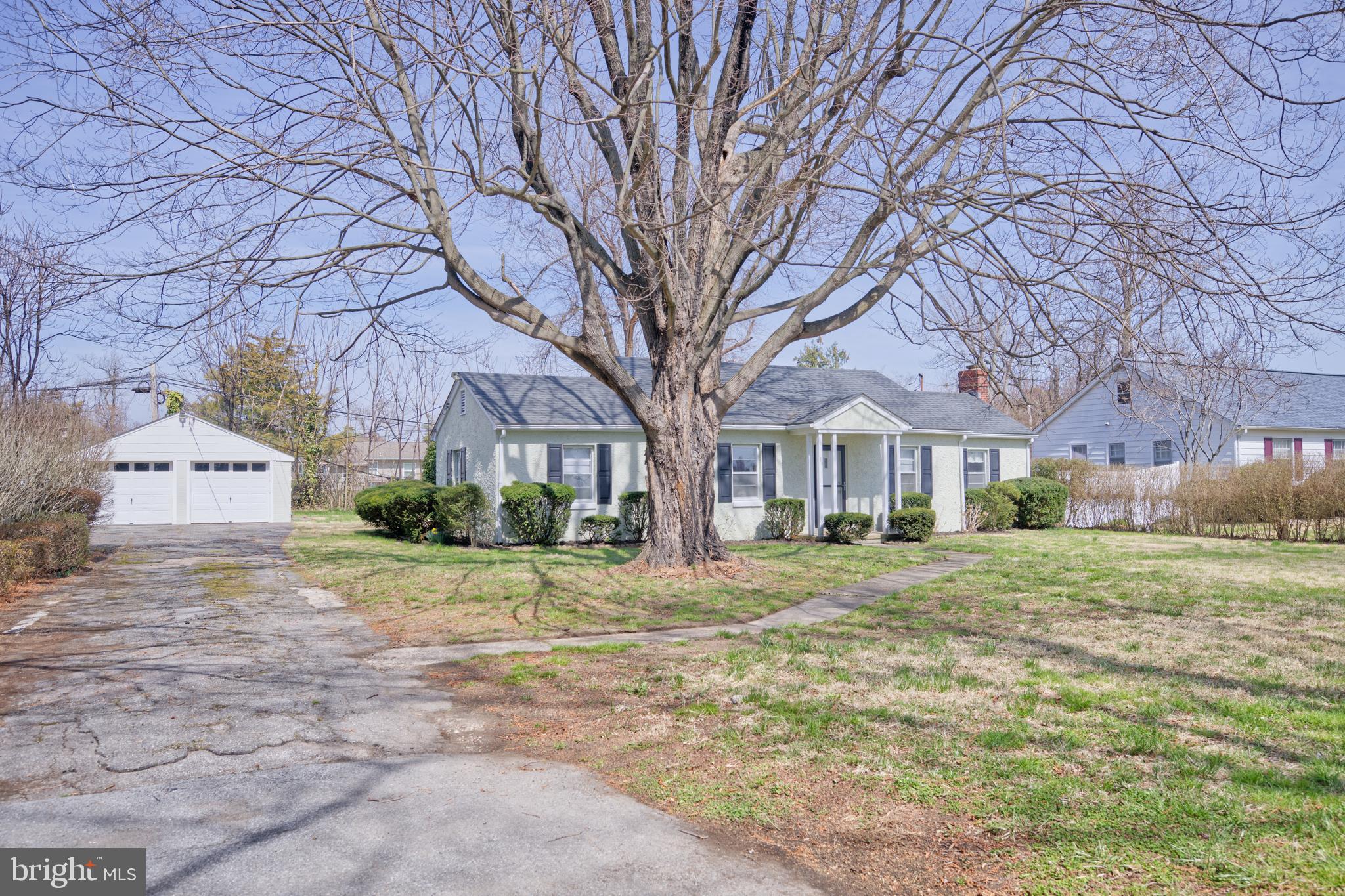 89 Cooper Road Dover, DE 19901 - Photo 2 of 32 a front view of a house with a yard