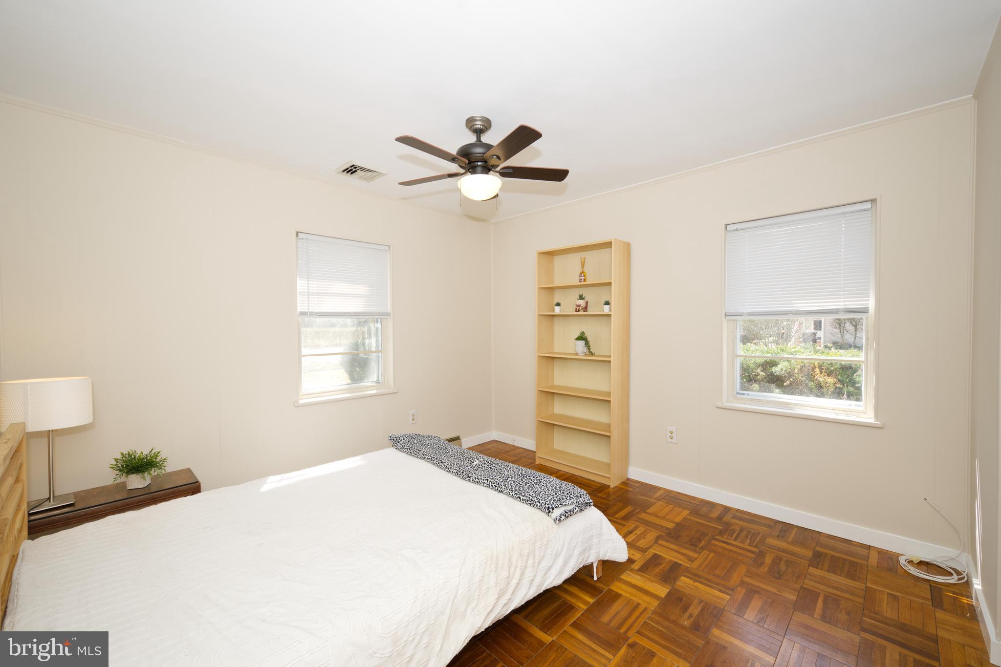 89 Cooper Road Dover, DE 19901 - Photo 22 of 32 a bedroom with a bed and a chandelier
