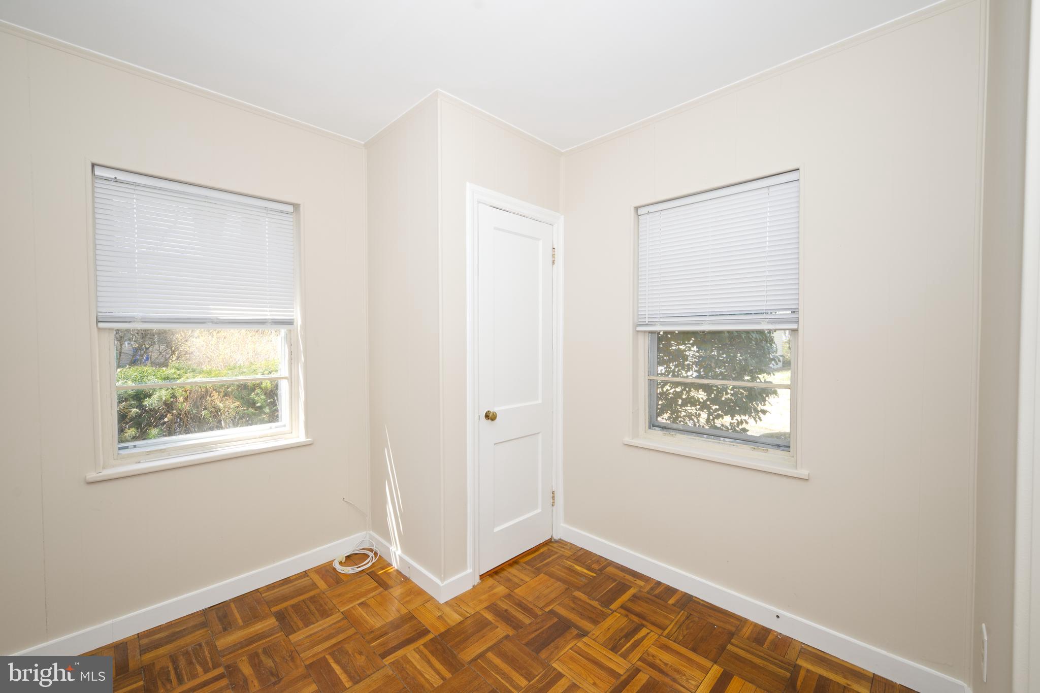 89 Cooper Road Dover, DE 19901 - Photo 23 of 32 a view of an empty room with wooden floor and a window