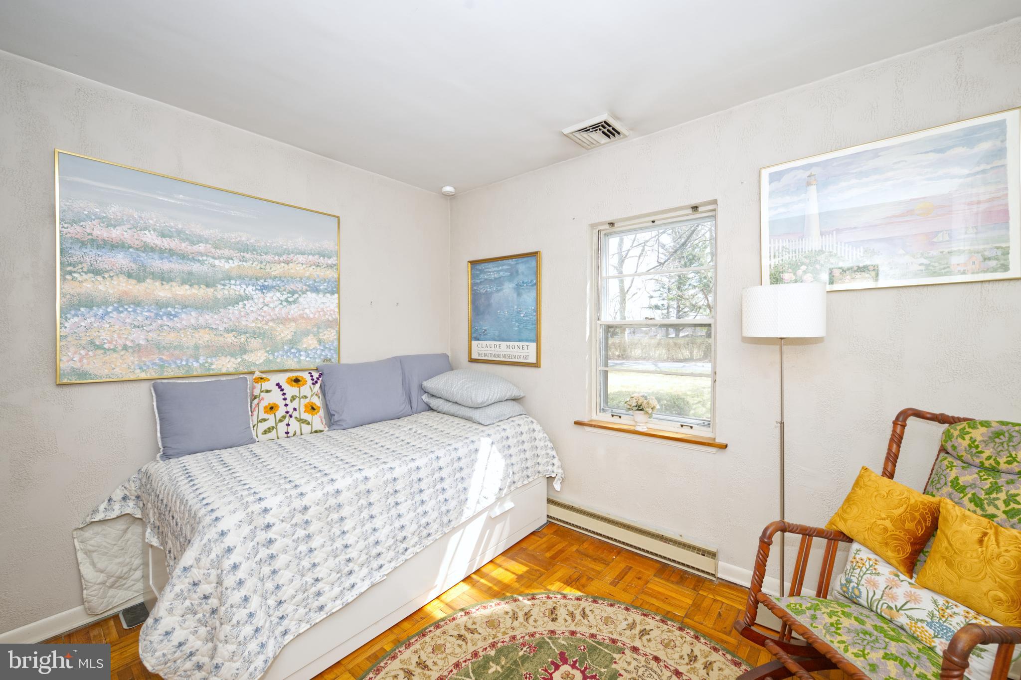 89 Cooper Road Dover, DE 19901 - Photo 24 of 32 a bedroom with a bed and wooden floor