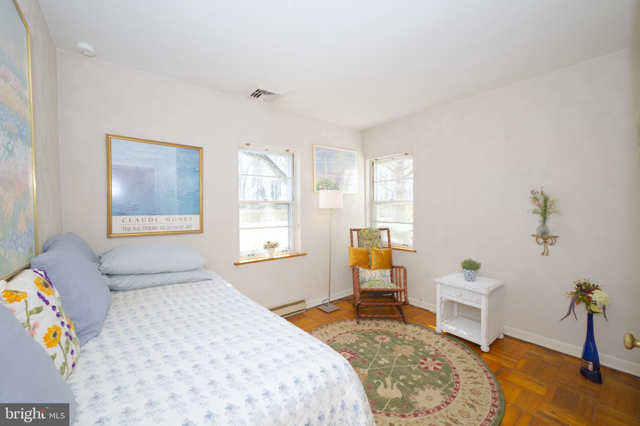 89 Cooper Road Dover, DE 19901 - Photo 25 of 32 a bedroom with a bed and wooden floor