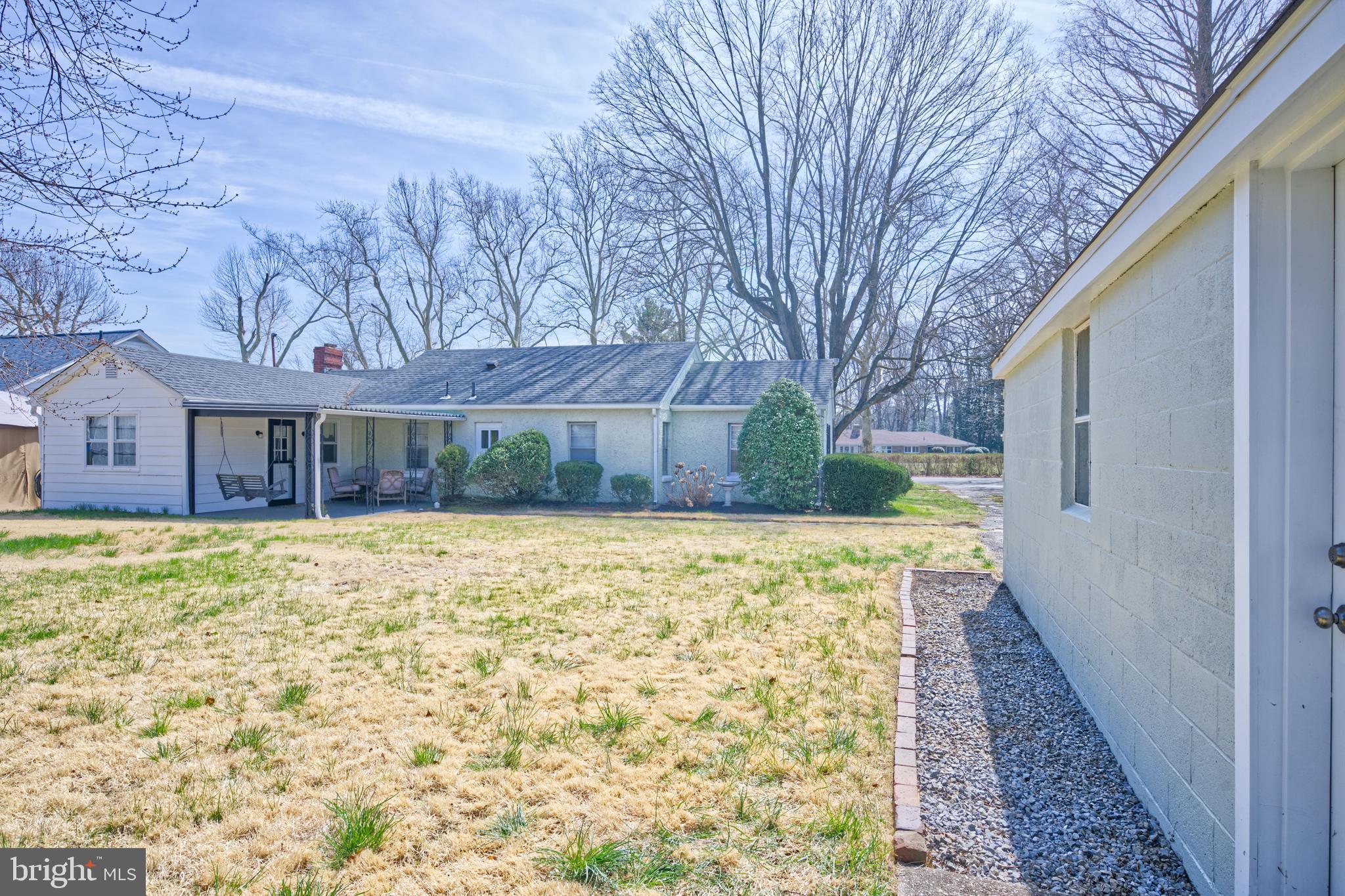 89 Cooper Road Dover, DE 19901 - Photo 7 of 32 a front view of a house with a yard