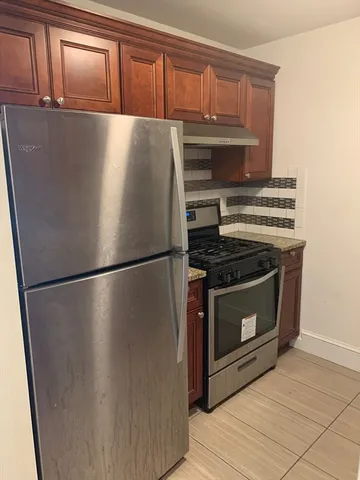 a close view of a stove top oven sitting inside of a kitchen