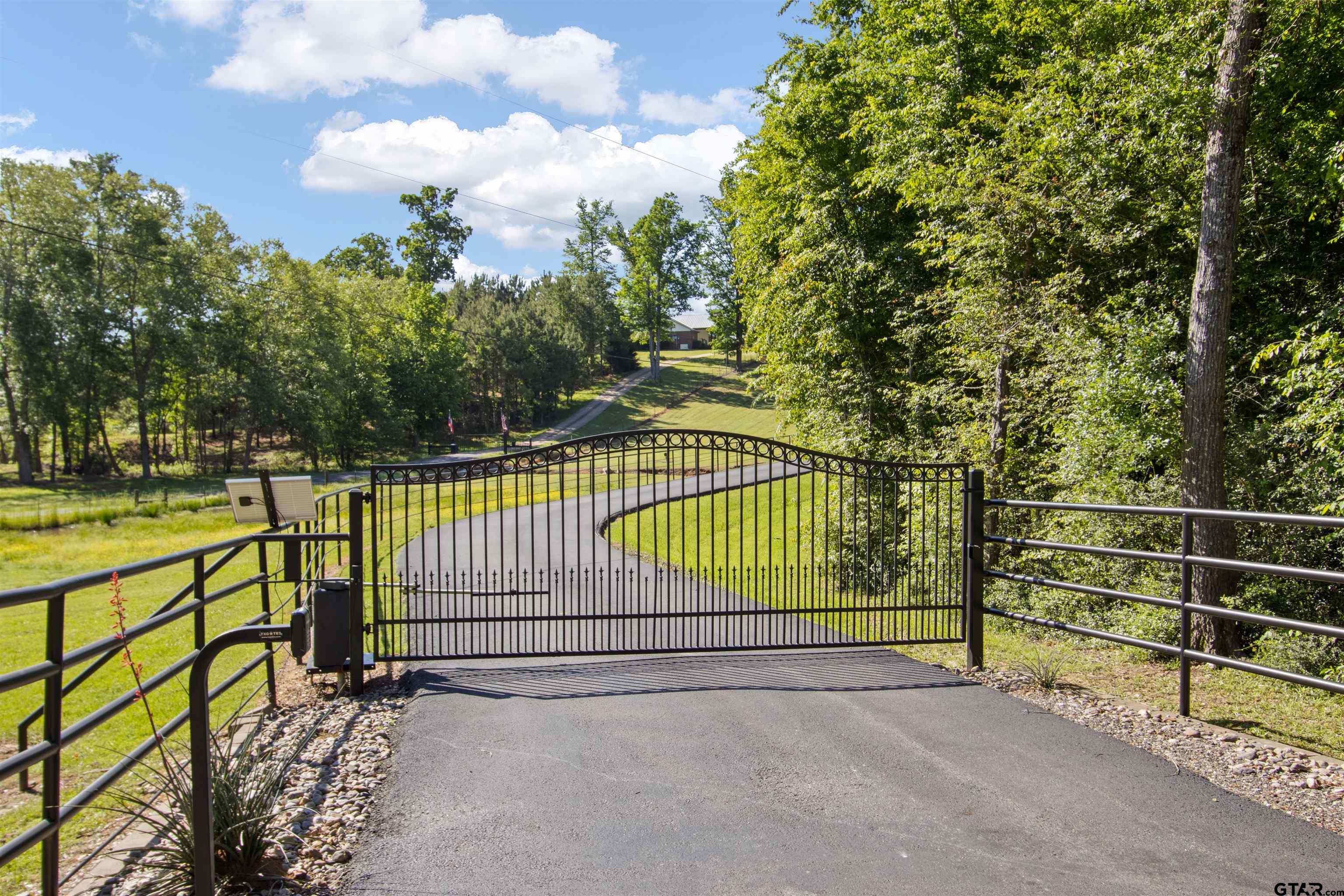 1506 Hamby Road Longview, TX 75605 - Photo 2 of 48 a view of a fence with a park