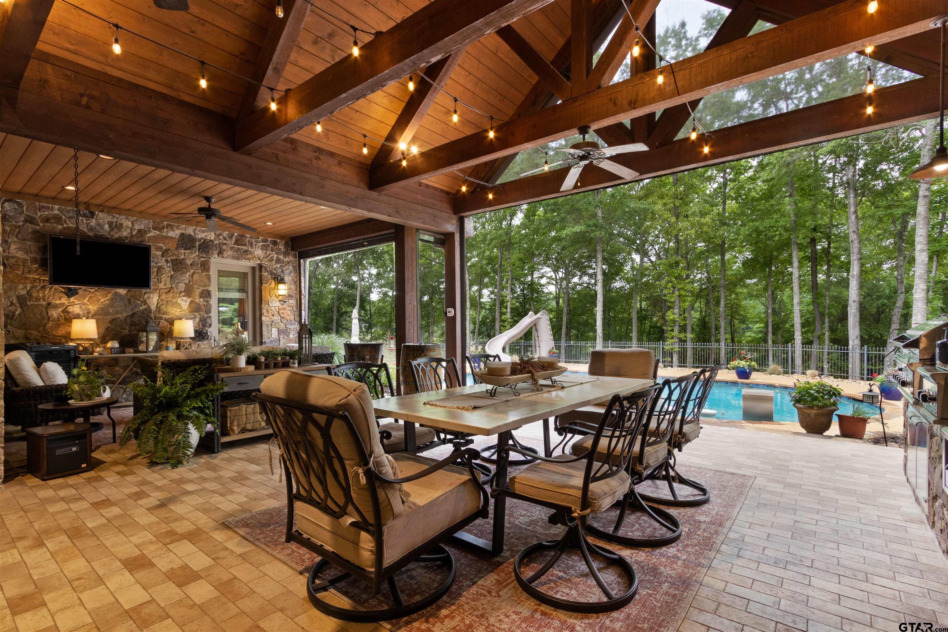1506 Hamby Road Longview, TX 75605 - Photo 24 of 48 a view of a dinning table and chairs in the patio