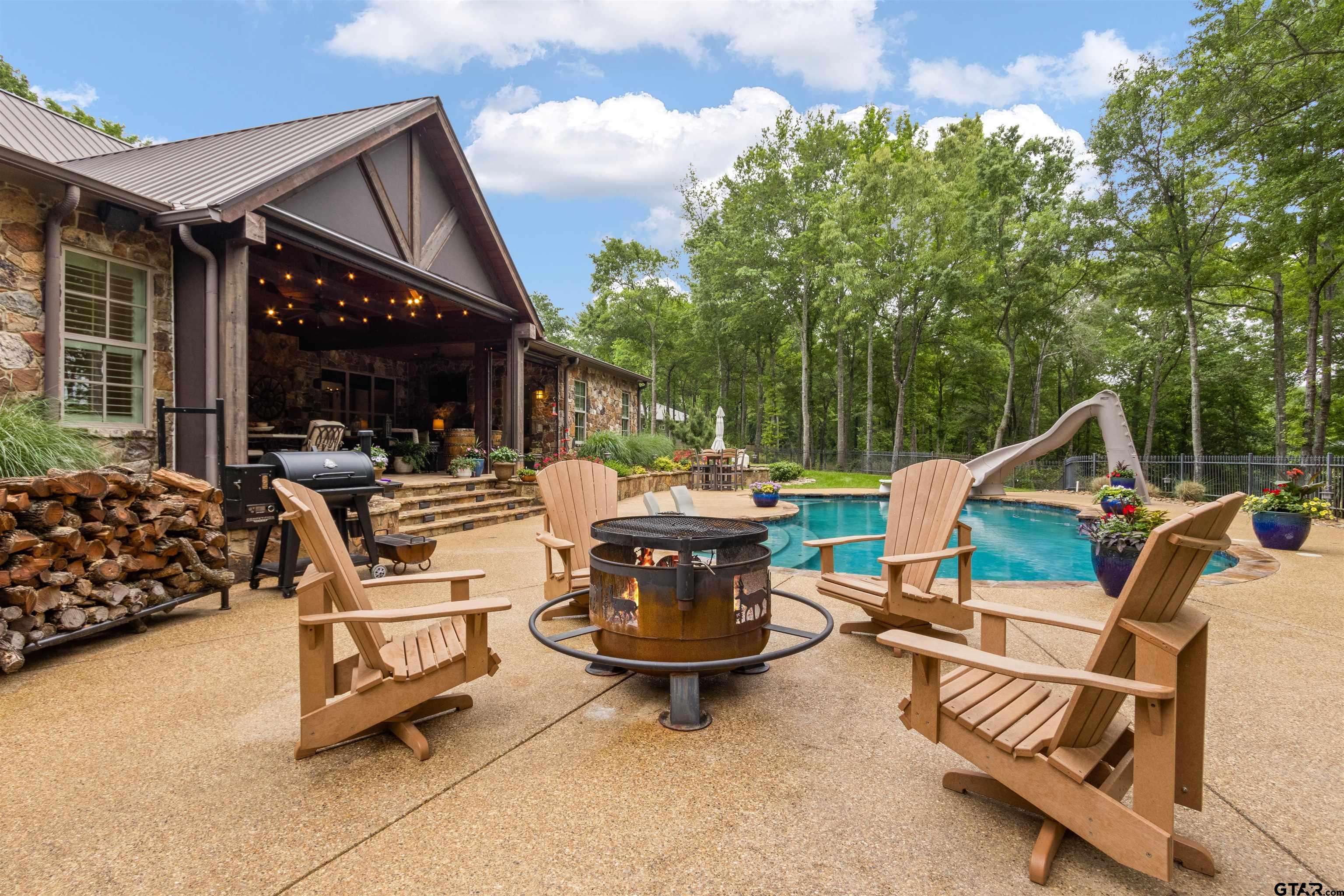 1506 Hamby Road Longview, TX 75605 - Photo 29 of 48 a view of a patio with a table and chairs