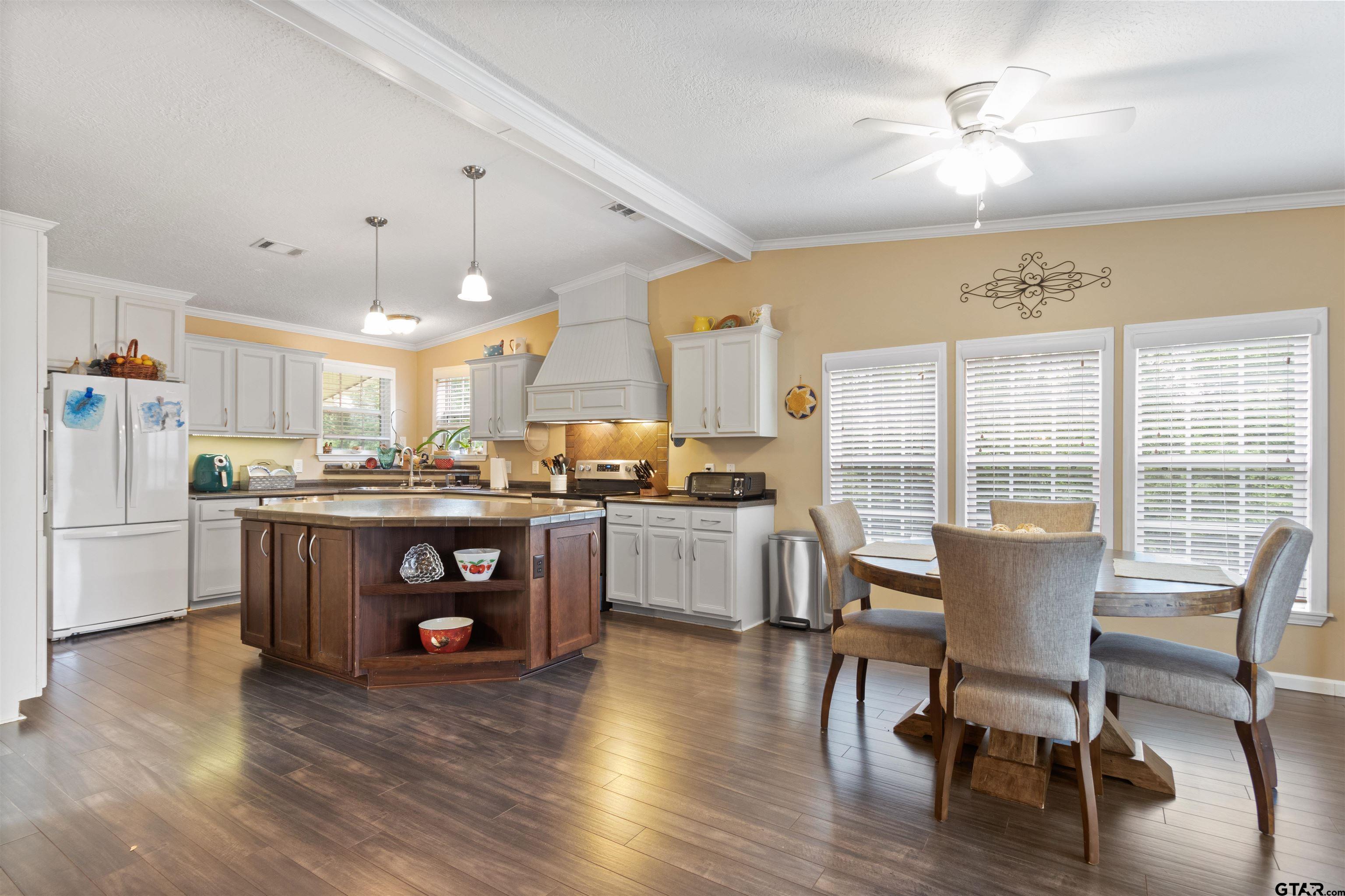 1506 Hamby Road Longview, TX 75605 - Photo 41 of 48 a view of a dining room with furniture window and wooden floor