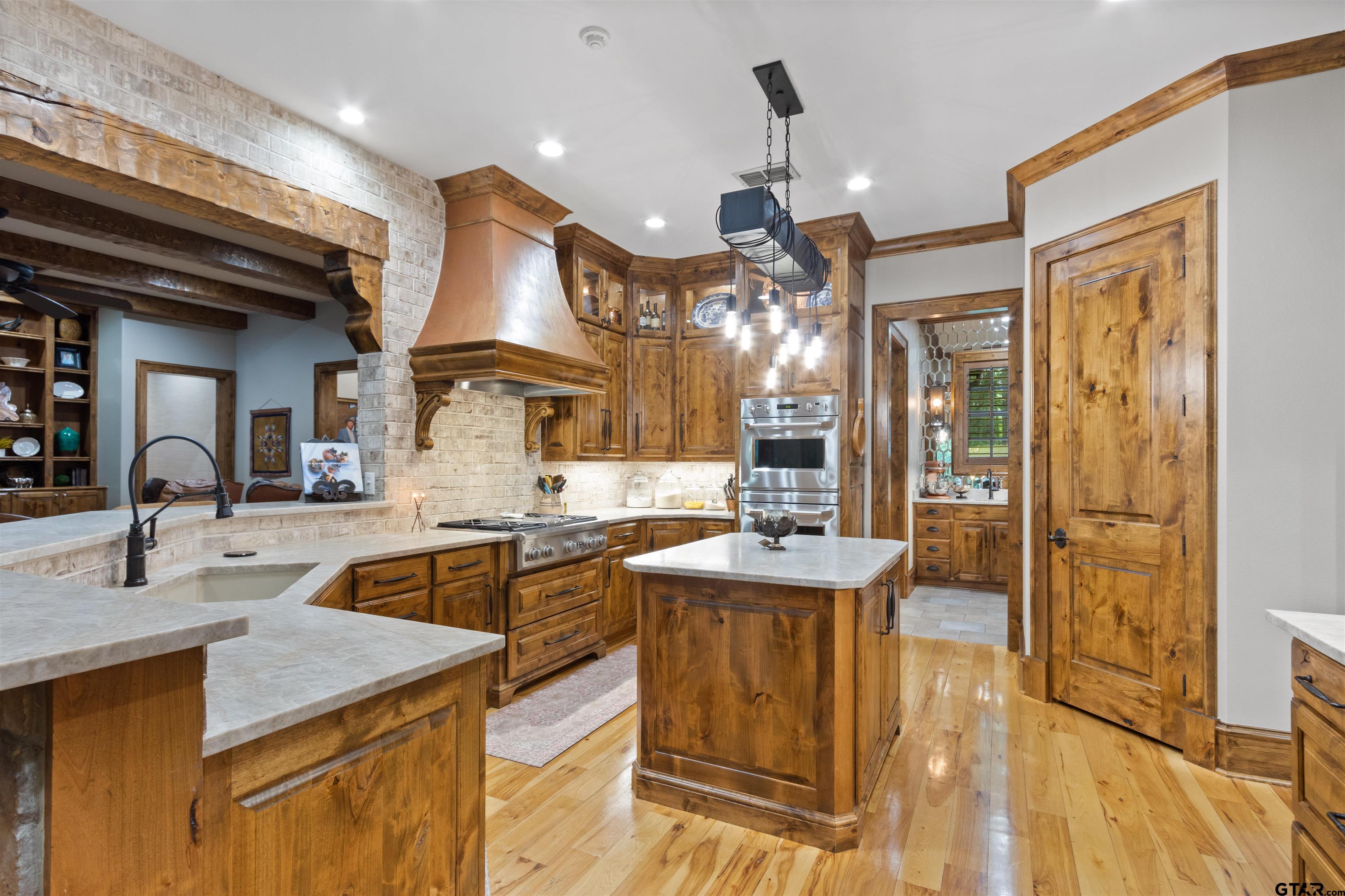 1506 Hamby Road Longview, TX 75605 - Photo 9 of 48 a kitchen with counter top space and living room view