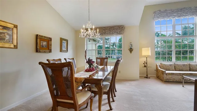 a dining room with furniture and window
