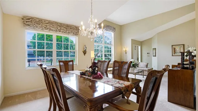 a view of a dining room with furniture window and outside view