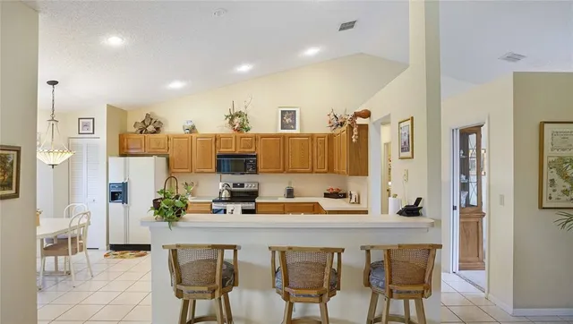 a kitchen with a sink cabinets and window