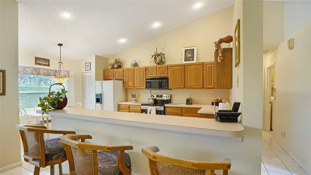 a kitchen with a sink cabinets and window