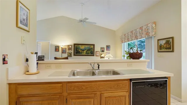 a view of a dining room with furniture and a window