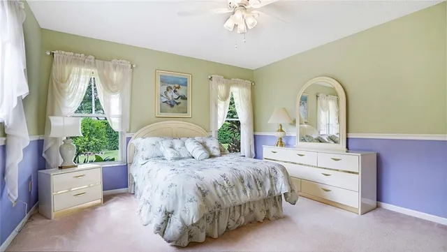 a bathroom with a sink a mirror a vanity and a shower