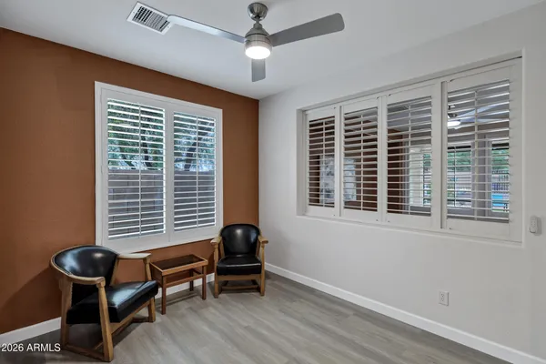 a view of a livingroom with furniture and a window