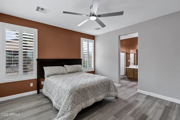 a bedroom with a large bed and a window