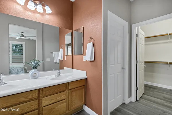 a bathroom with a double vanity sink and a mirror