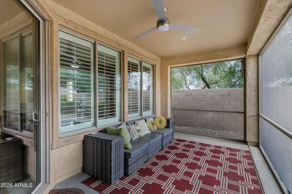 a living room with furniture and a rug
